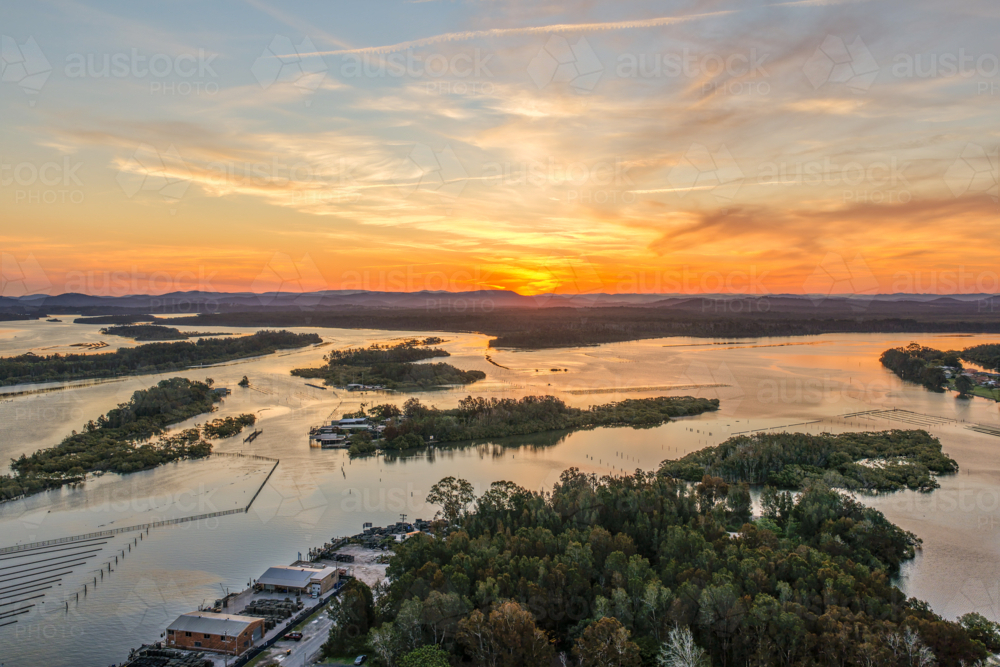 Aerial image capturing the Coolongolook River in Tuncurry at sun set - Australian Stock Image