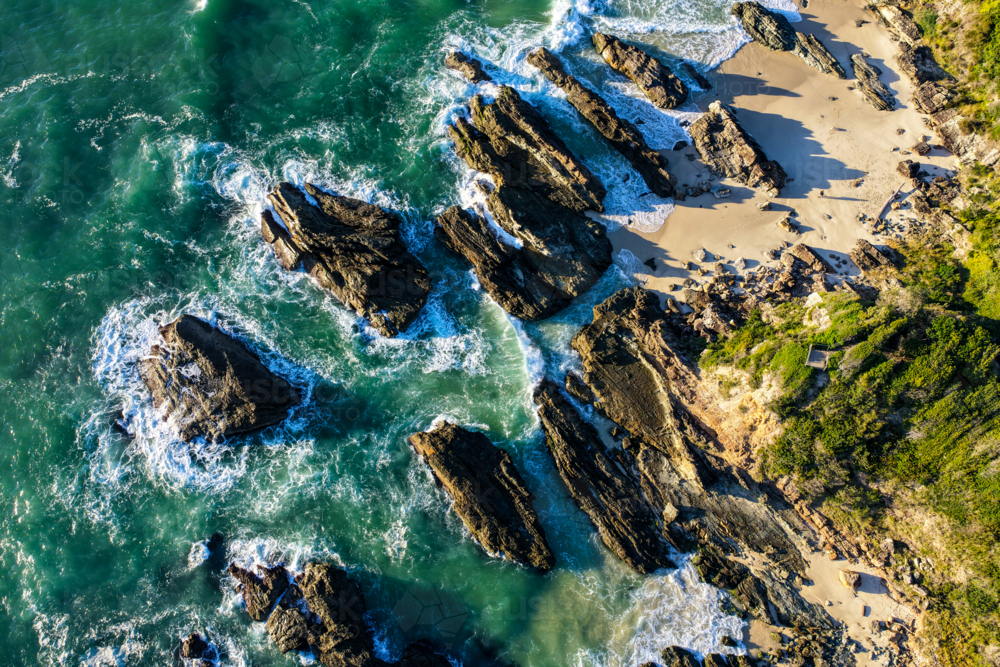 Aerial image capturing the rugged rocky coastline of Burgess Beach, Forster - Australian Stock Image