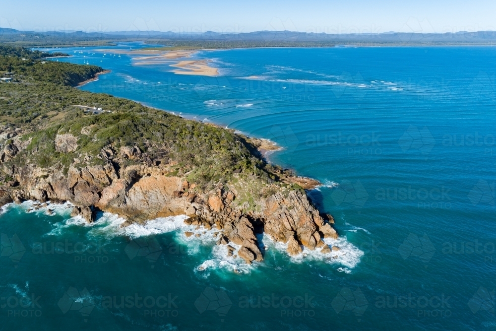 Aerial image looking at Round Hill headland, Round Hill Creek, and the Town of 1770, Queensland. - Australian Stock Image