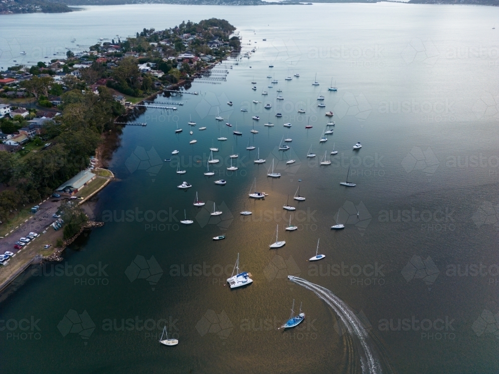 Aerial image looking south from Gosford at boats moored in Brisbane Water at dusk - Australian Stock Image