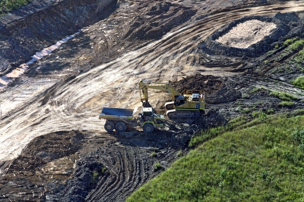 Aerial image of a truck and digger on land clearing - Australian Stock Image