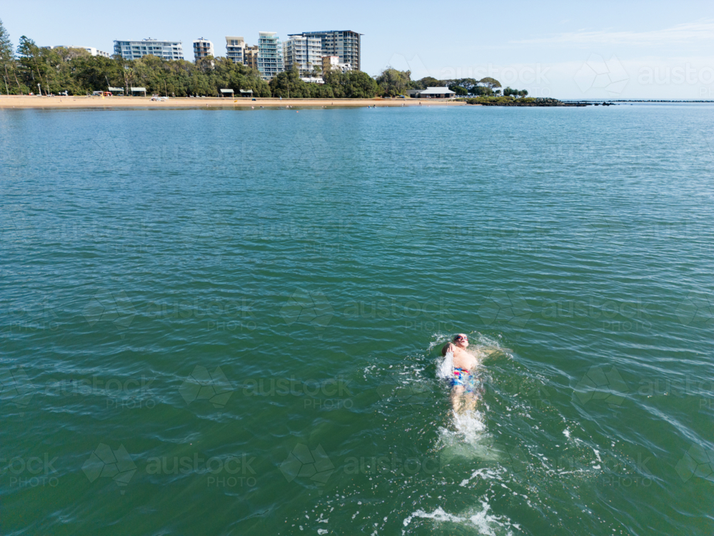 Aerial image of an open water swimmer off Suttons Beach, Redcliffe - Australian Stock Image
