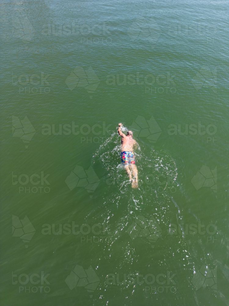 Aerial image of an open water swimmer off Suttons Beach, Redcliffe - Australian Stock Image