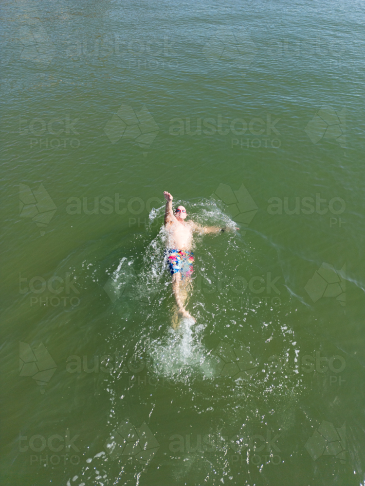 Aerial image of an open water swimmer off Suttons Beach, Redcliffe - Australian Stock Image