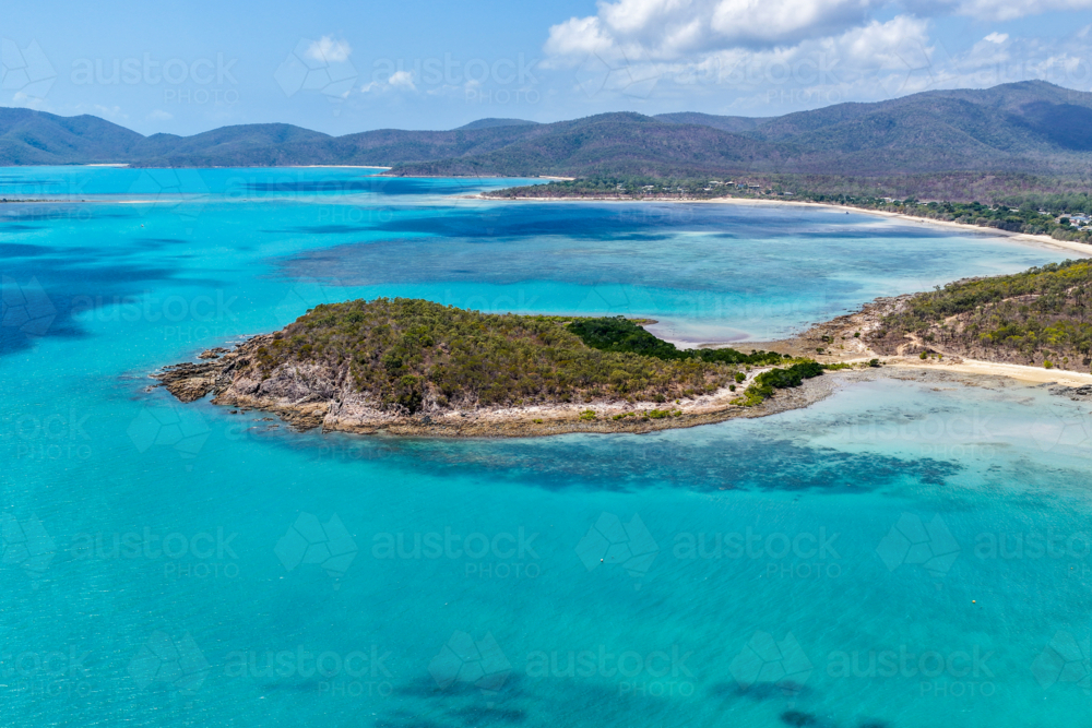 Aerial image of Hydeaway Bay, capturing its brilliant turquoise water, rocky headlands - Australian Stock Image