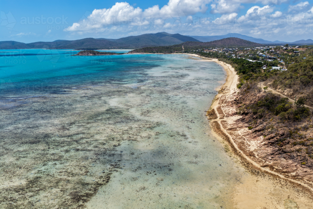 Aerial image of Hydeaway Bay, capturing its brilliant turquoise water, rocky headlands - Australian Stock Image