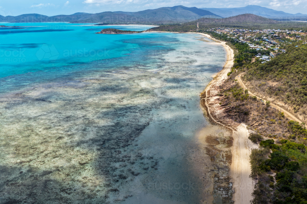Aerial image of Hydeaway Bay, capturing its brilliant turquoise water, rocky headlands - Australian Stock Image