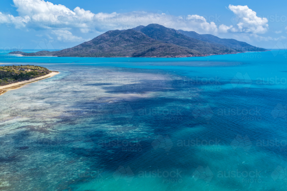 Aerial image of Hydeaway Bay, capturing its brilliant turquoise water, rocky headlands - Australian Stock Image