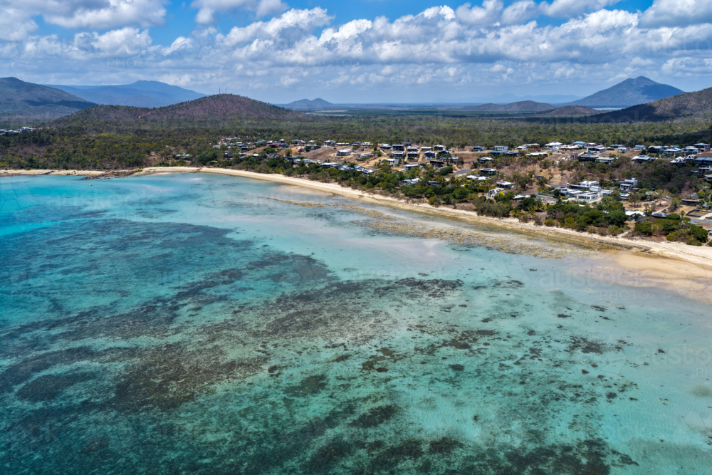 Aerial image of Hydeaway Bay, capturing its brilliant turquoise water, rocky headlands - Australian Stock Image