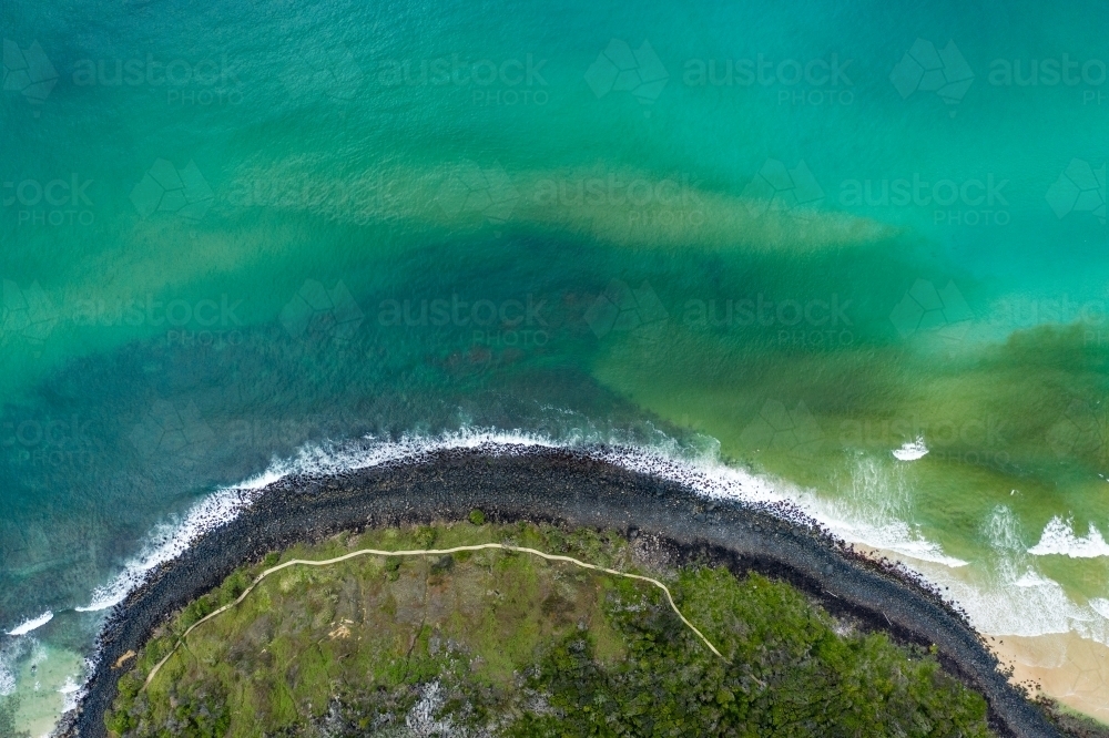 Aerial image of rocky coastline and beach front walking track - Australian Stock Image
