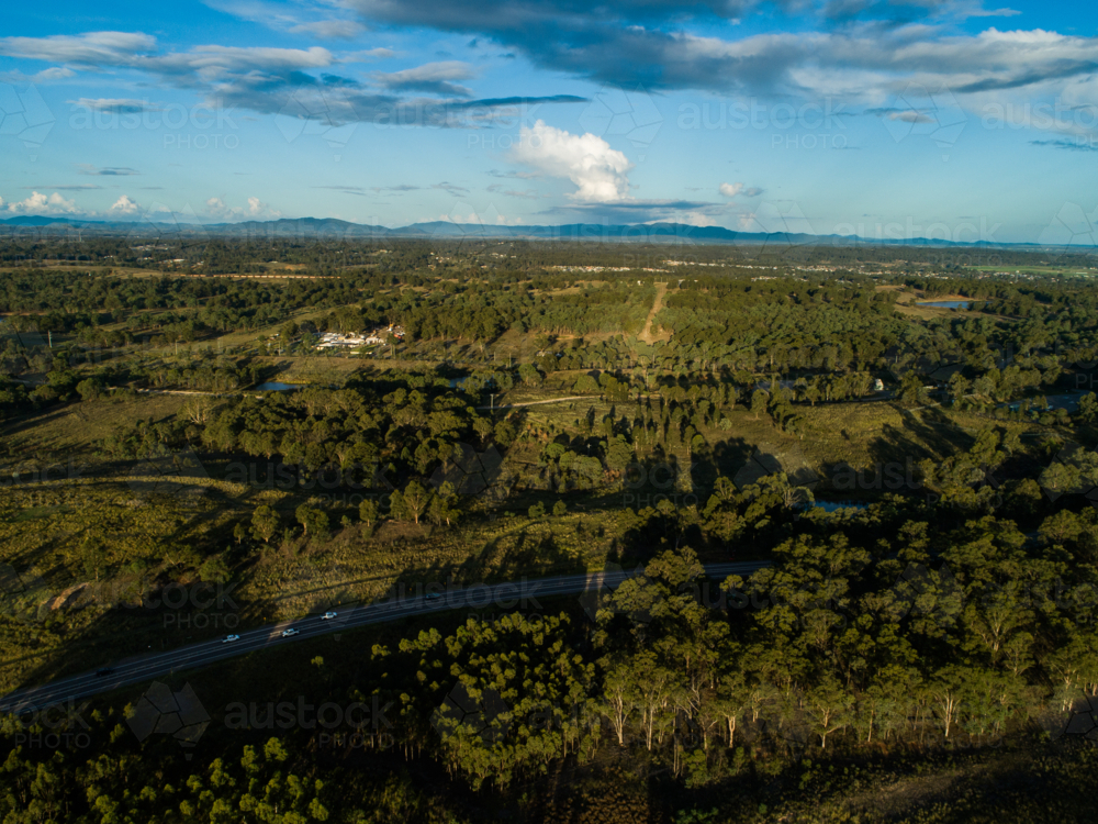 Aerial landscape looking over treetops near singleton - Australian Stock Image