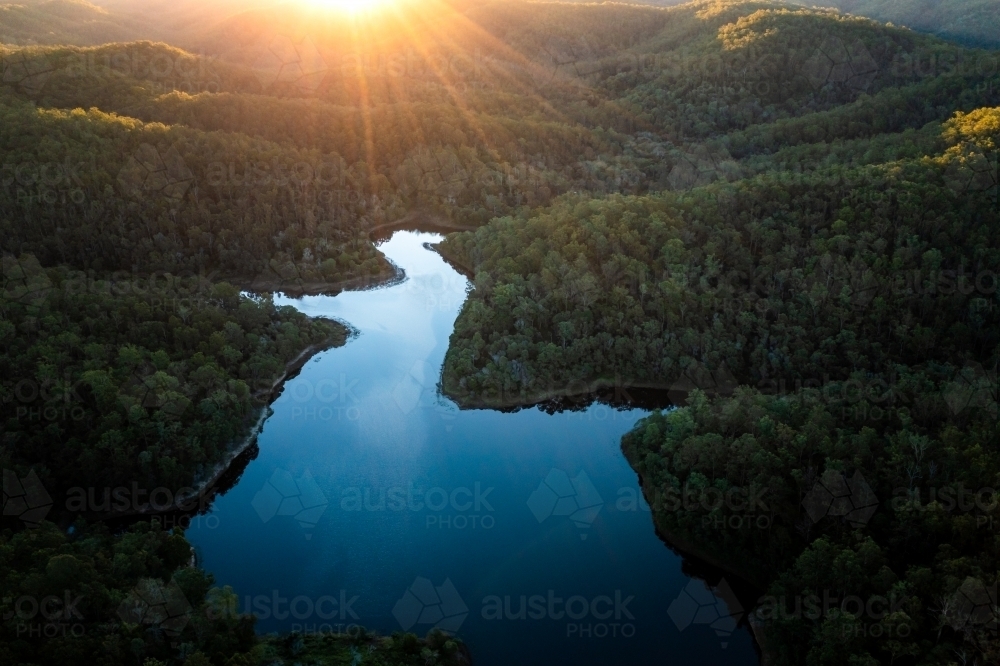 Aerial landscape of a lake surrounded by forest - Australian Stock Image