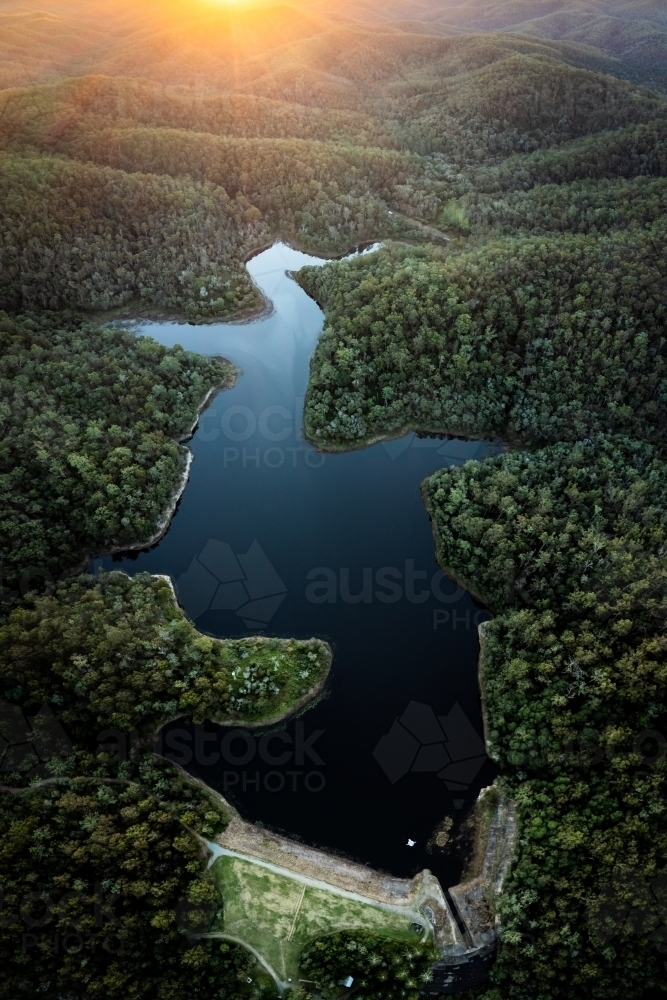 Aerial landscape of a lake surrounded by forest - Australian Stock Image