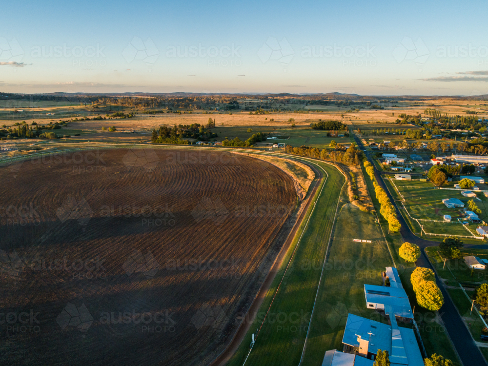 Aerial landscape of Glen Innes racecourse track at sunset - Australian Stock Image