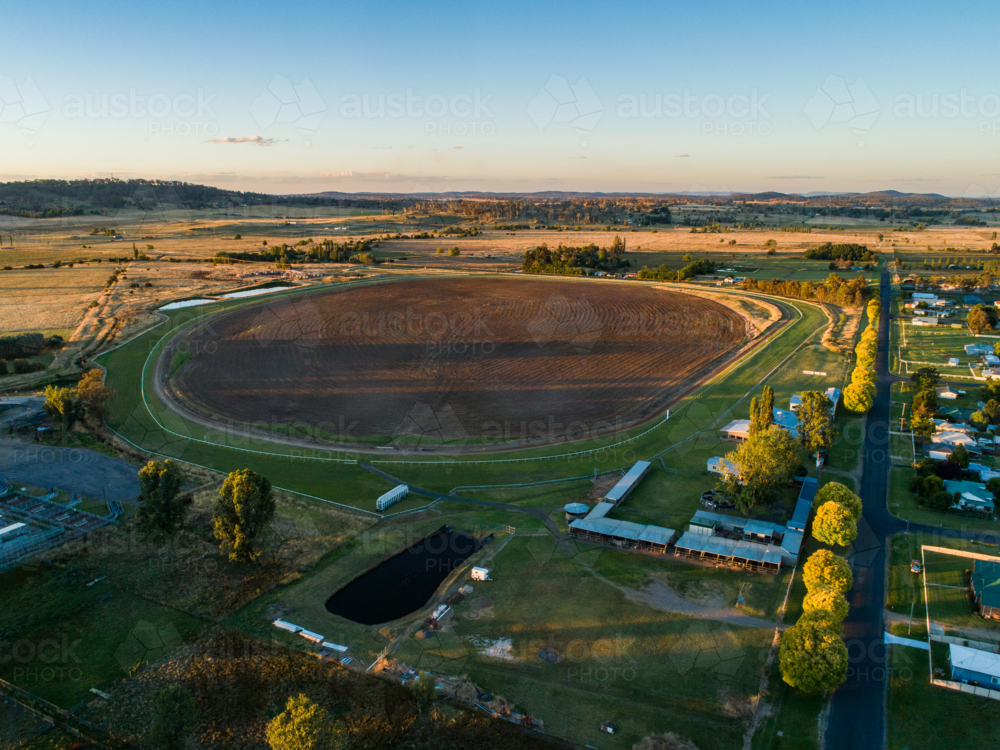 Aerial landscape of Glen Innes racecourse track at sunset - Australian Stock Image