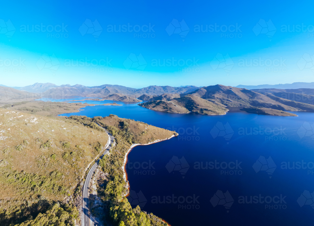 Aerial landscape of Lake Pedder on a hot summer's afternoon in Southwest National Park, Tasmania - Australian Stock Image