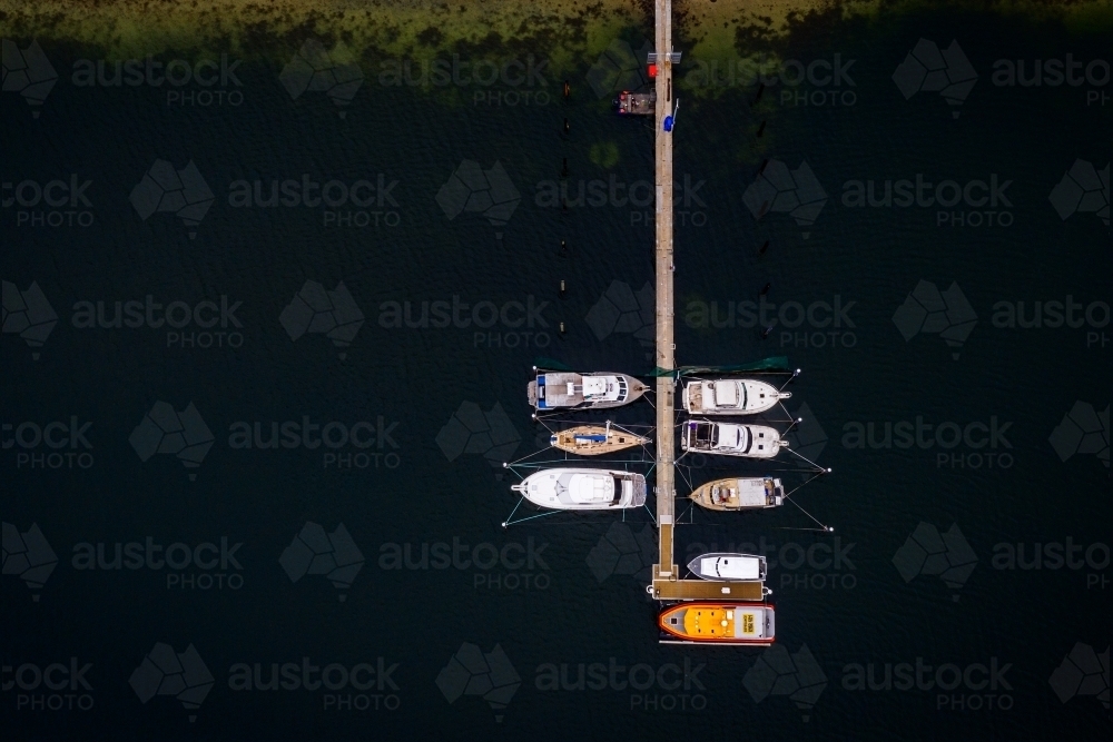 Aerial of boats anchored at Jetty - Australian Stock Image