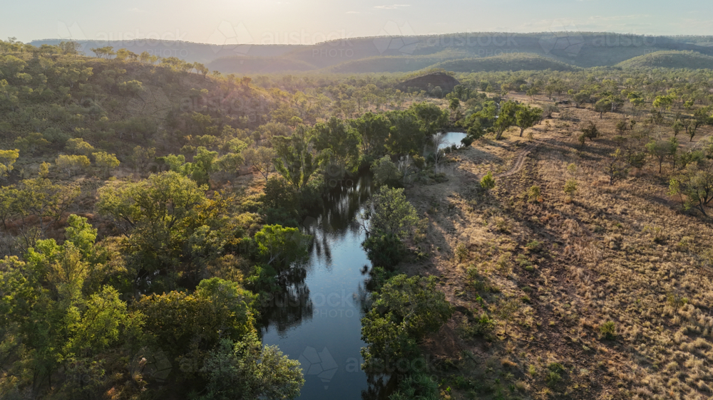 Aerial of river running through remote bushland - Australian Stock Image