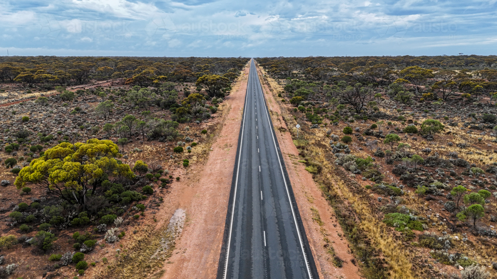 Aerial of straight road into the distance - Australian Stock Image
