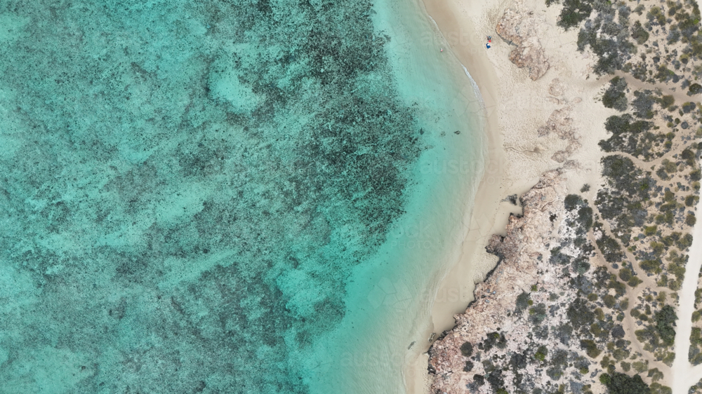 Aerial of the reef meeting the land - Australian Stock Image