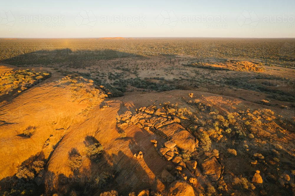 Aerial of Walgahna Walga Rock at sunset near Cue Western Australia - Australian Stock Image