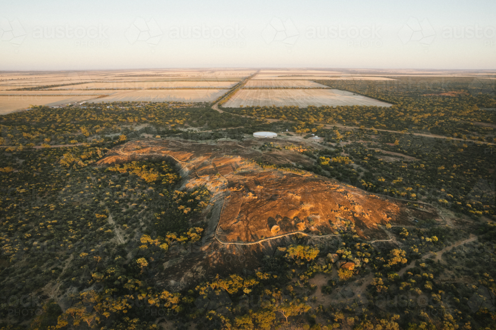 Aerial over Beringbooding Rock at sunrise in the eastern Wheatbelt of Western Australia - Australian Stock Image