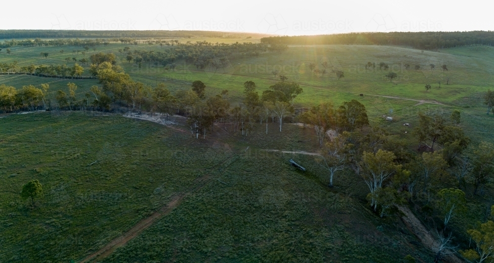 Aerial panorama of a farm creek at dusk. - Australian Stock Image