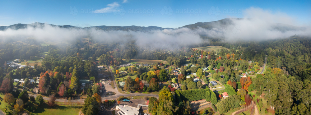 Image of Aerial panorama of a rural town in a mountain valley with ...