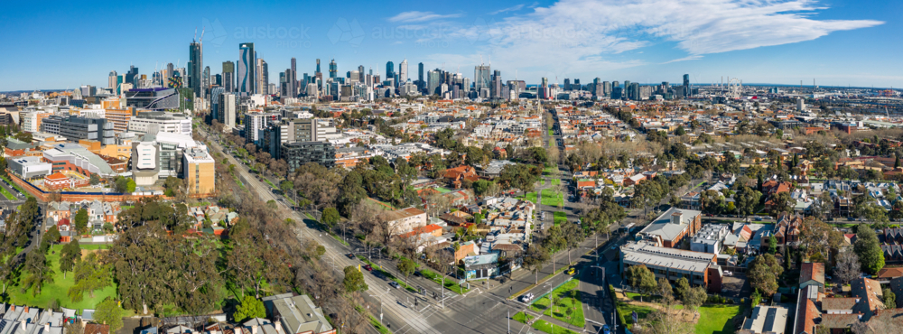 Aerial panorama of an inner city housing in front of a city skyline - Australian Stock Image