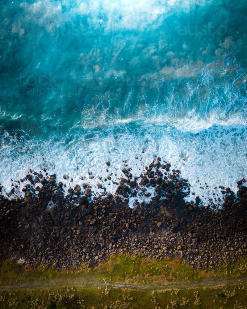 Aerial Perspective - Green Grass, a Dirt Trail, and Crashing Blue Waves - Australian Stock Image
