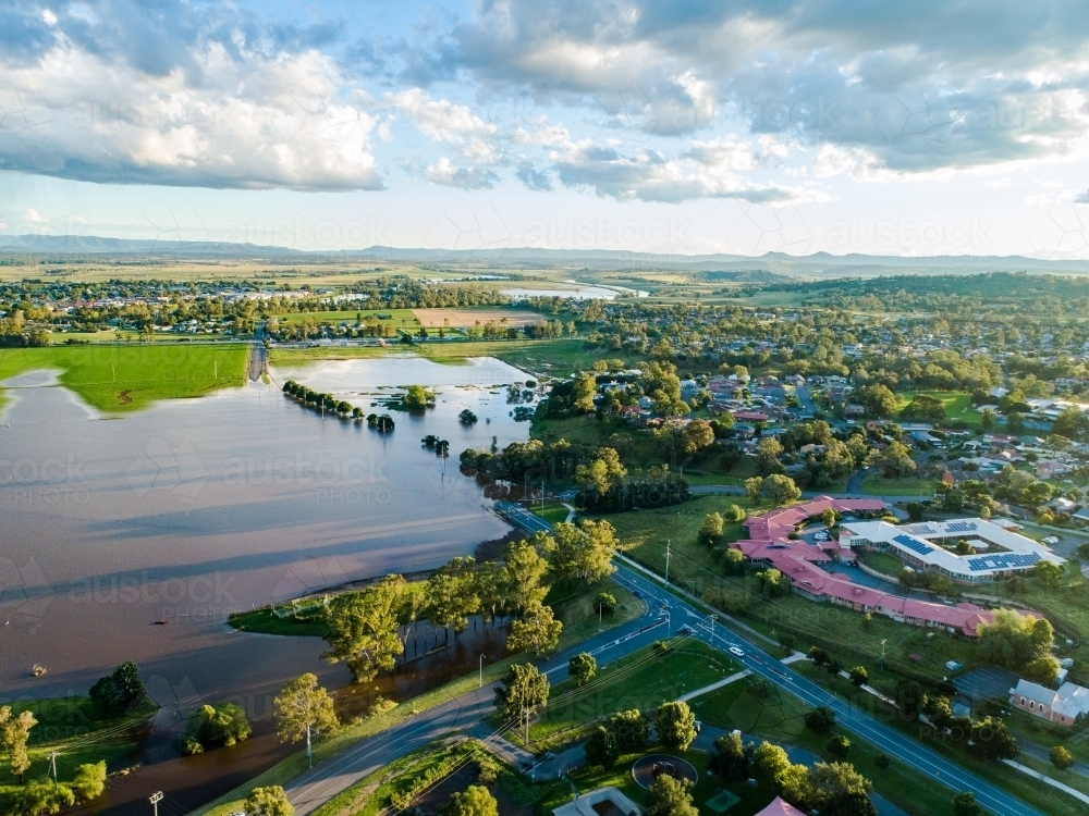Aerial perspective of underwater road during flood in Singleton - Australian Stock Image