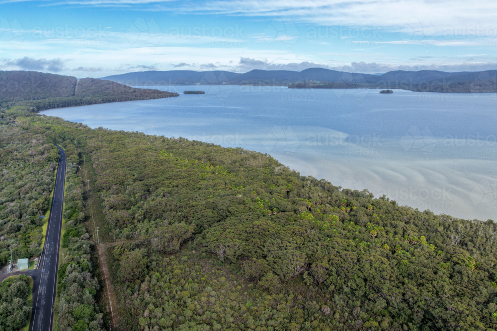 Aerial scene capturing Wallis Lake and Booti Hill and surrounding landscape - Australian Stock Image