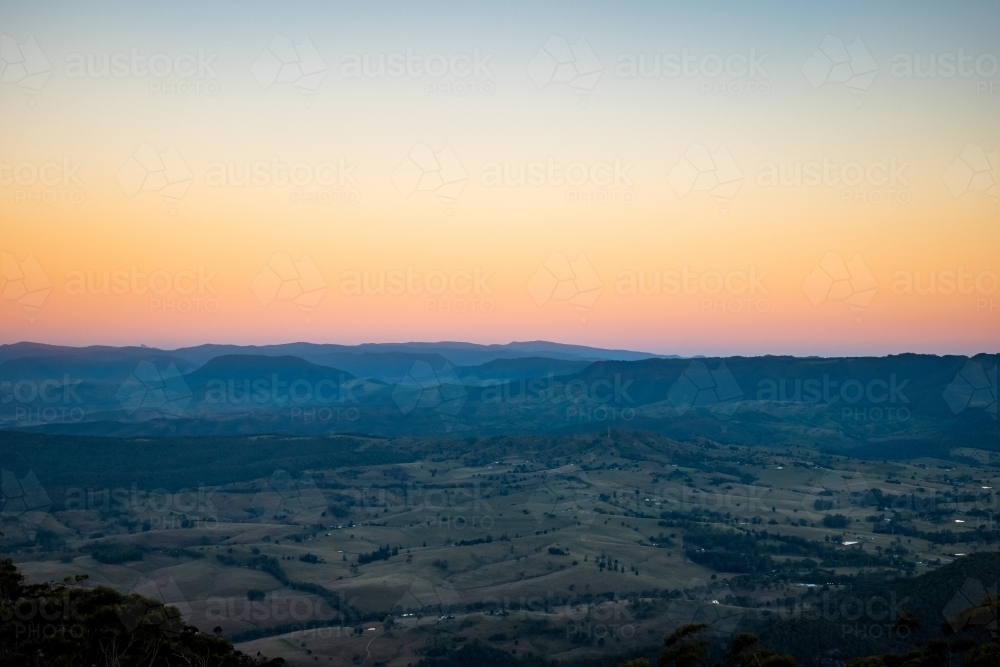 Aerial shot of a plain with yellow and orange skies - Australian Stock Image