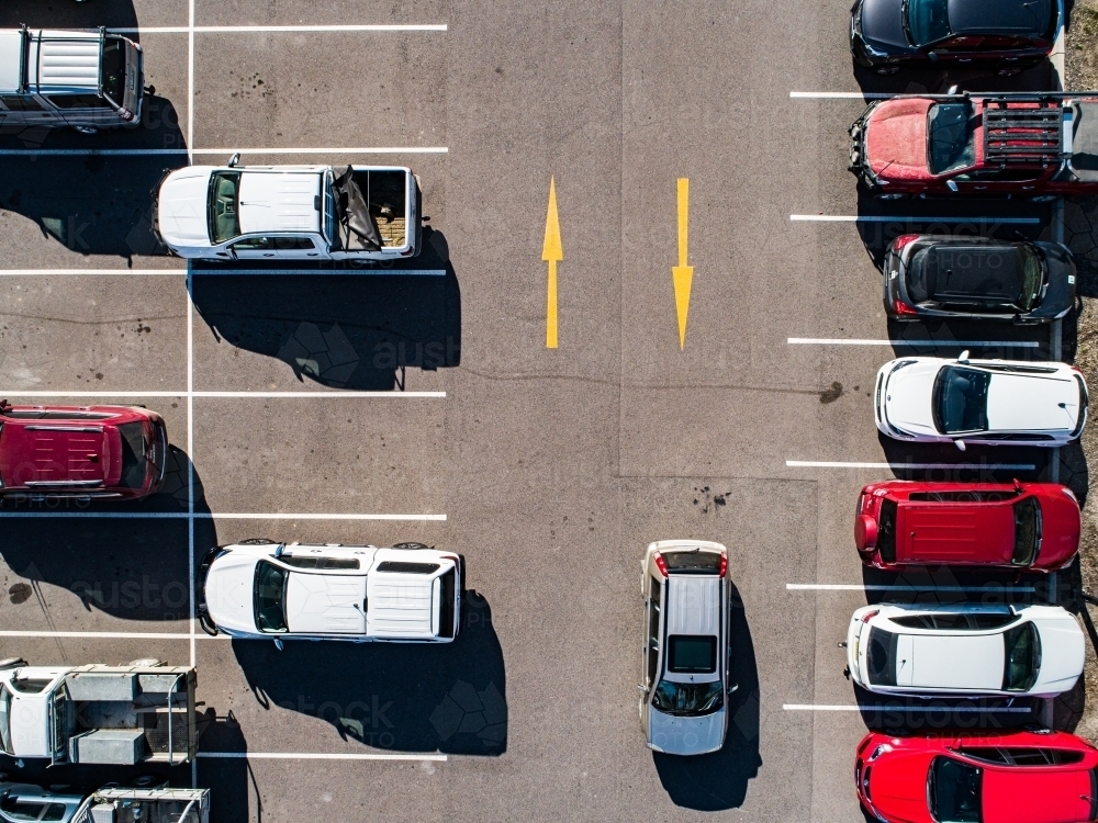 Aerial shot of cars parked in carpark with empty spaces - Australian Stock Image