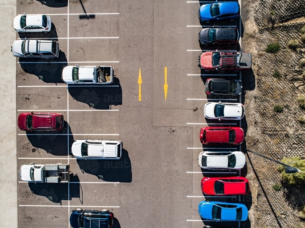 Image of Aerial shot of cars parked in carpark with empty spaces ...