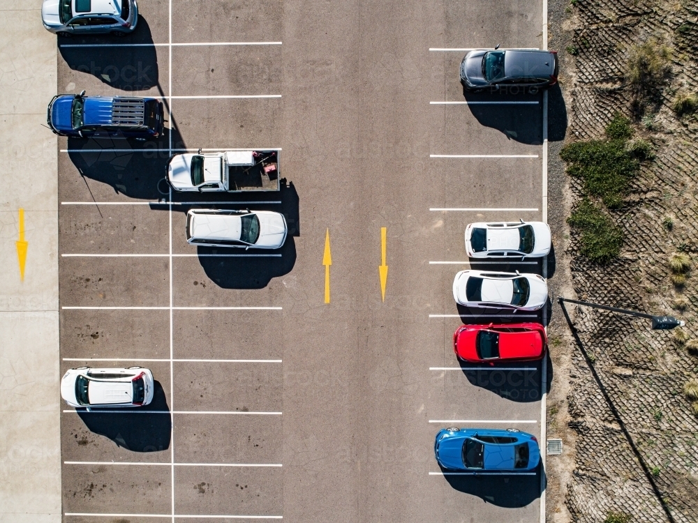 Aerial shot of cars parked in carpark with empty spaces - Australian Stock Image