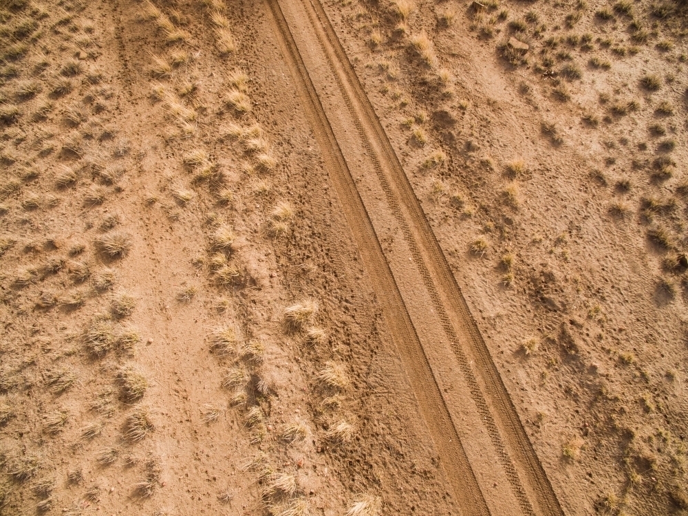 Aerial shot of dirt road in a paddock - Australian Stock Image