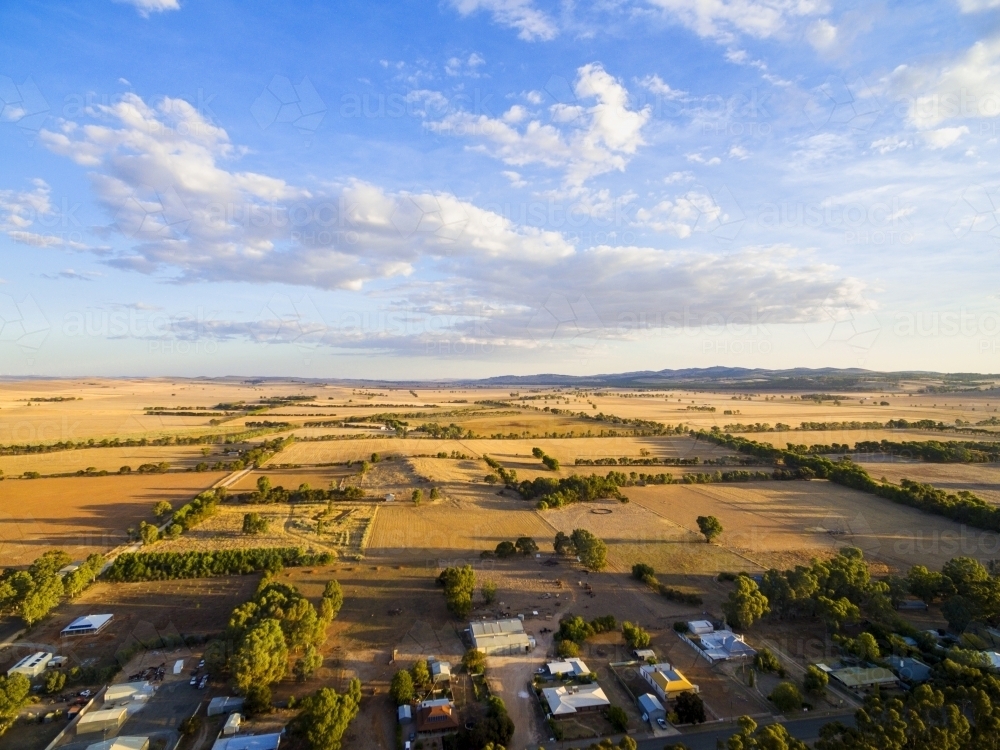 Aerial shot of farmland at the edge of a town - Australian Stock Image