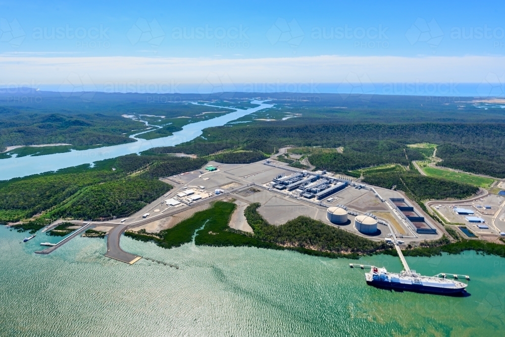 Aerial shot of liquified natural gas plant and LNG ship on Curtis Island, Queensland - Australian Stock Image