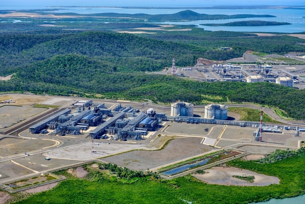 Aerial shot of liquified natural gas plants on Curtis Island, Queensland - Australian Stock Image