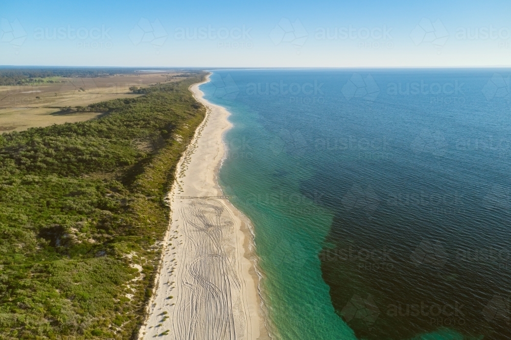 Aerial shot of long sandy beach and the ocean in Australia's South West. - Australian Stock Image