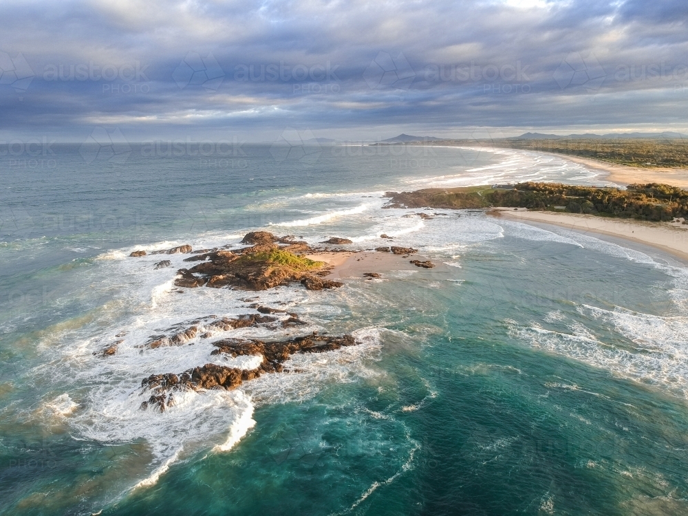 Aerial shot of Sawtell beach in the afternoon - Australian Stock Image