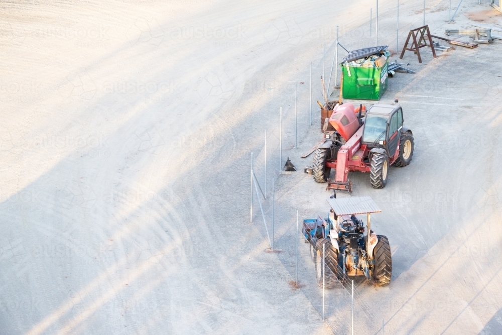 Aerial shot of two big trucks on a huge white colored sand - Australian Stock Image