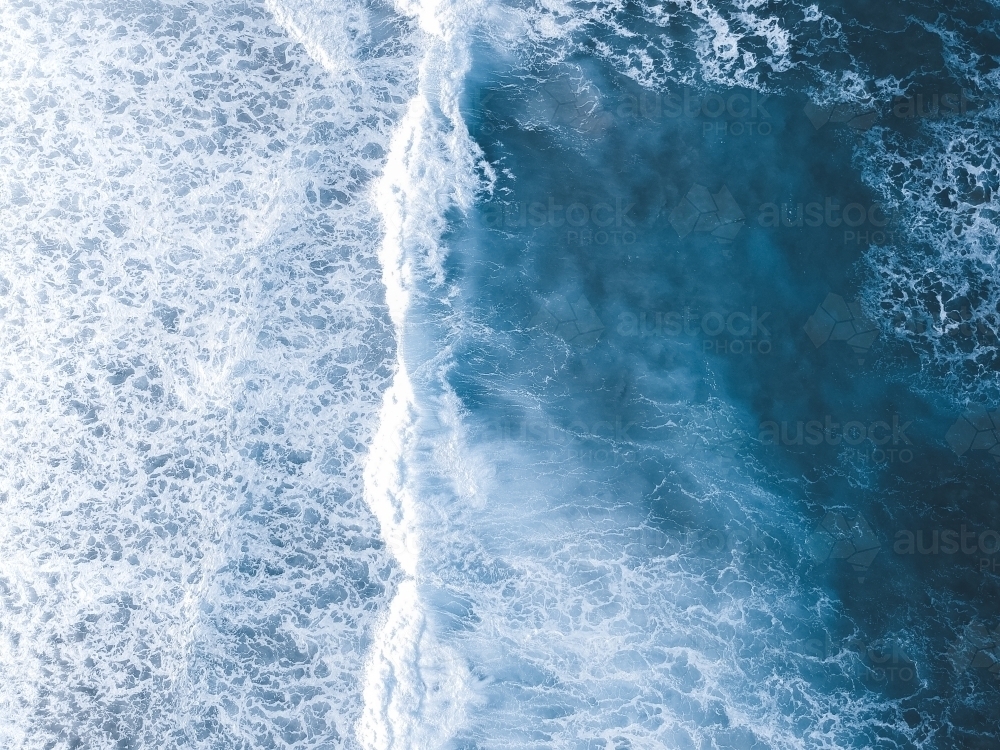 Aerial shot of waves rolling in from the ocean - Australian Stock Image