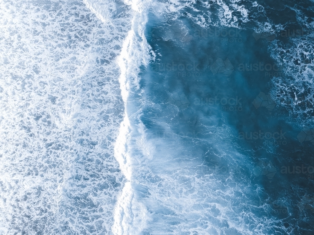 Aerial shot of waves rolling in from the ocean - Australian Stock Image