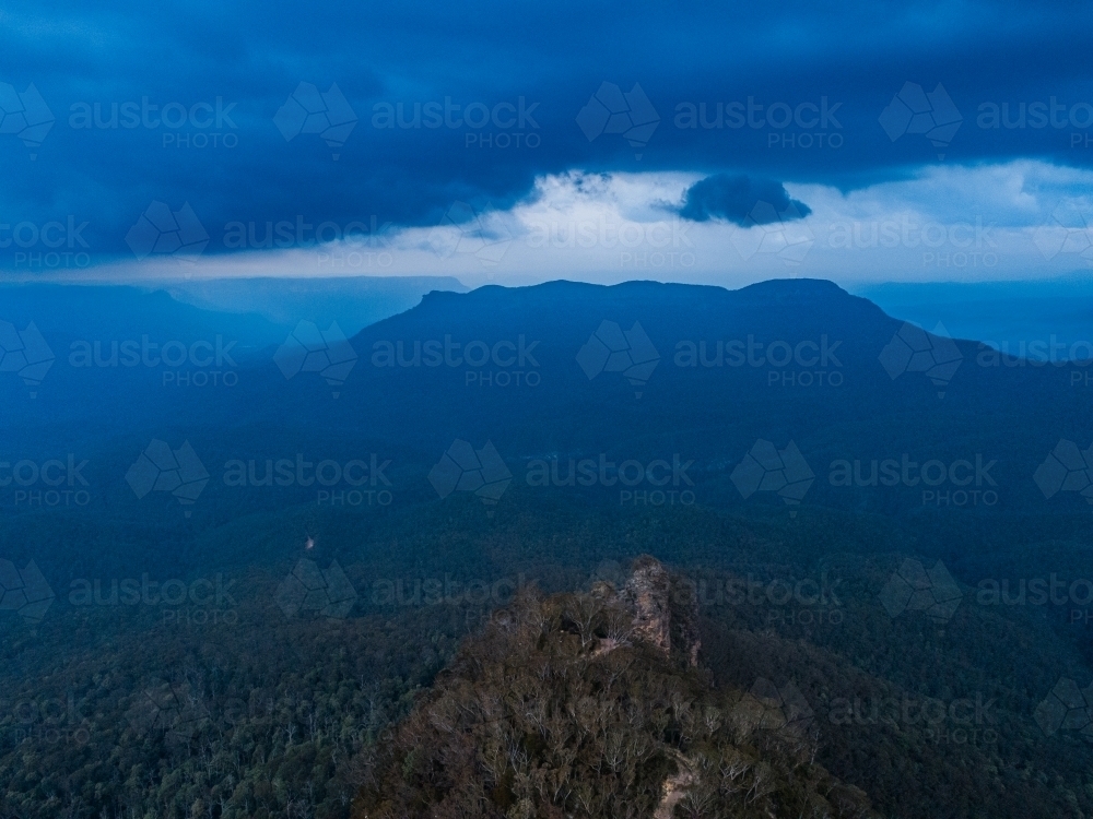 Aerial side view three sisters and storm approaching over Blue Mountains - Australian Stock Image