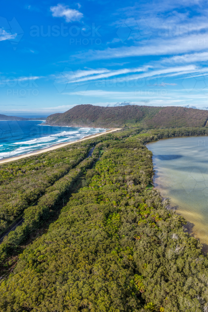Aerial vertical scene capturing Seven Mile Beach and Wallis Lake near Forster, NSW, Australia - Australian Stock Image