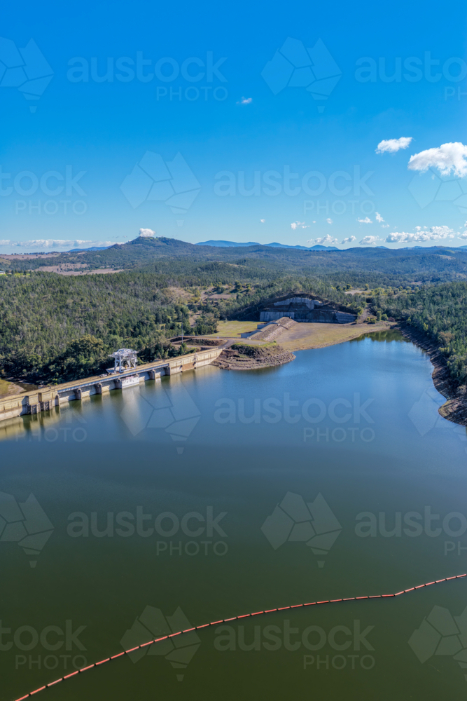 Aerial vertical view showcasing the Lake Keepit dam wall, engineering infrastructure and landscape - Australian Stock Image