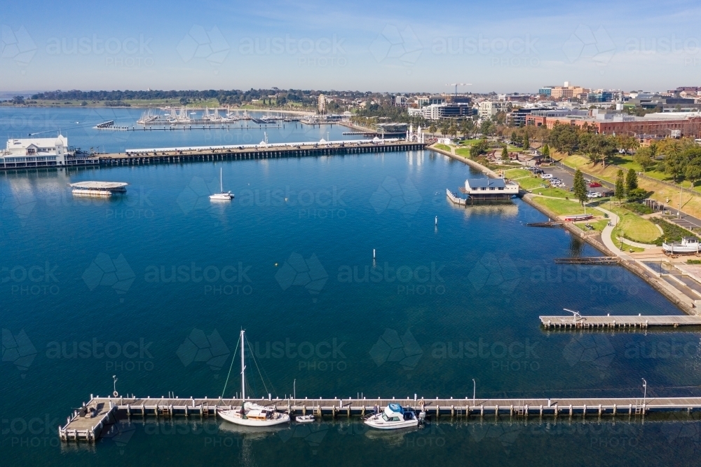 Image of Aerial view along a city coastline with yachts and boats ...