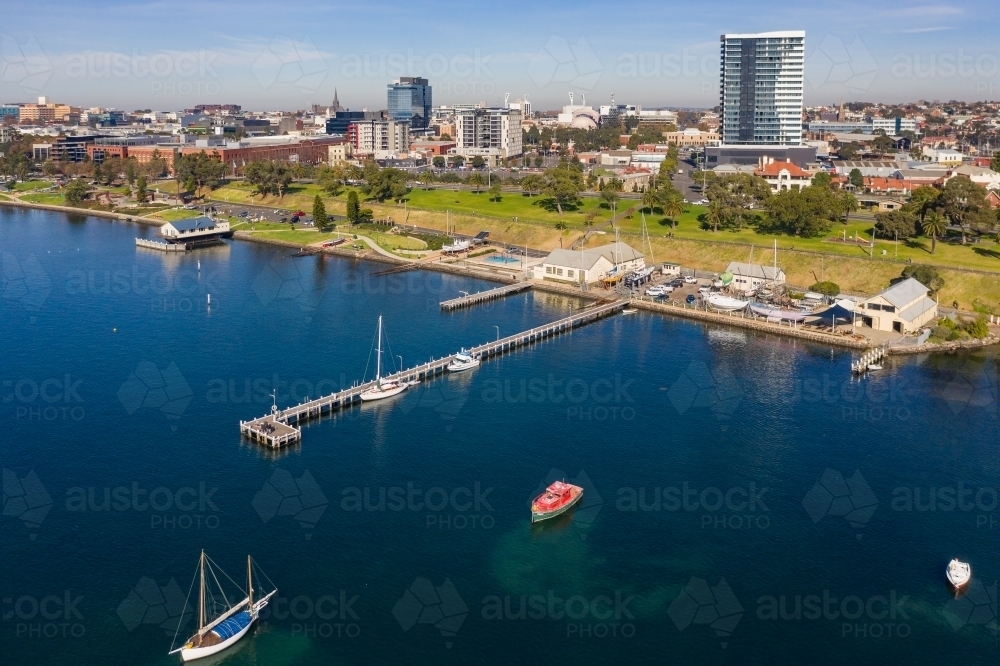 Image of Aerial view along a city coastline with yachts and boats ...